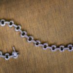 Stunning vintage diamond bracelet with multiple chain links on a wooden background