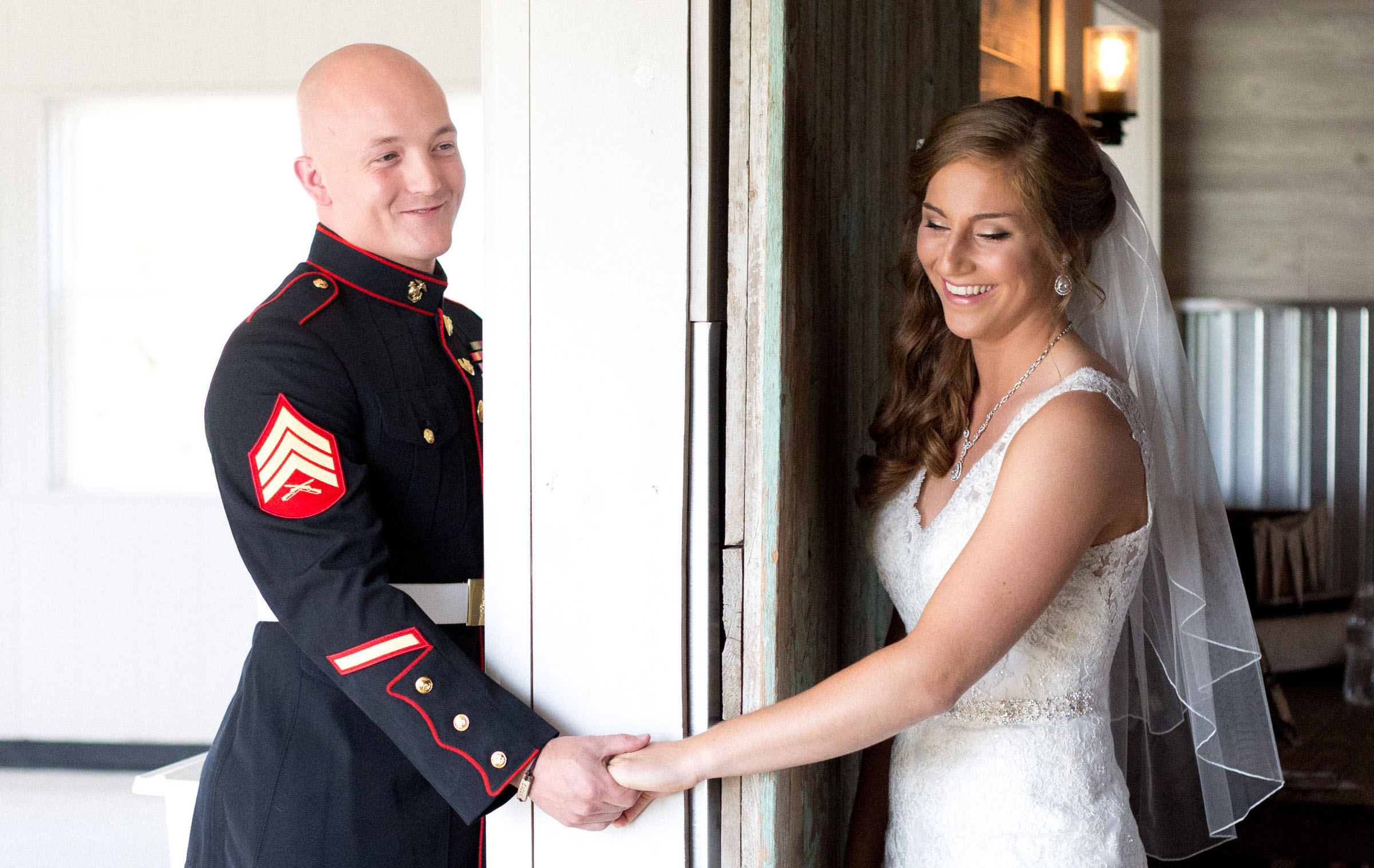 Kirk Kara military couple during wedding photoshoot holding hands