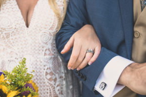 Kirk Kara couple showing off engagement and wedding rings during Hawaiian wedding