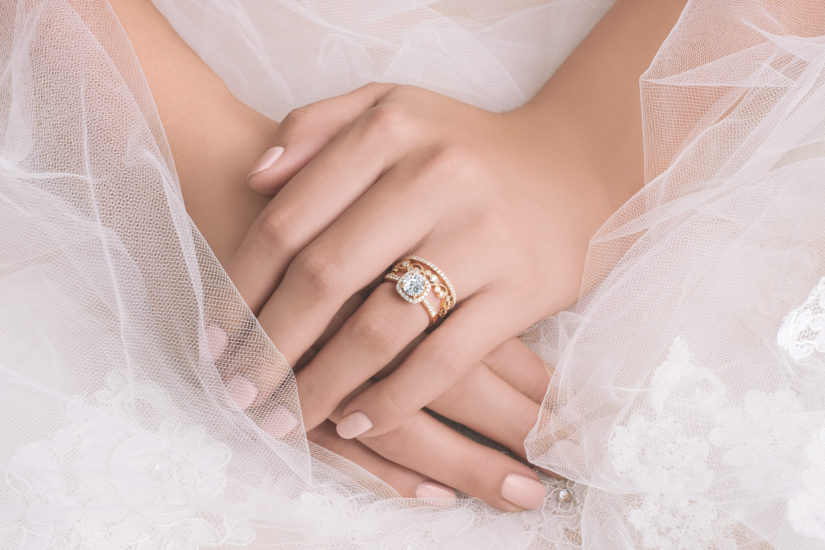 Kirk Kara engagement and wedding rings on a brides hand