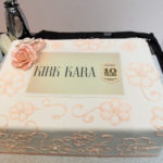 Wonderfully decorated cake celebrating Kirk Kara's tenth year win of the Jewelers Choice award fro bridal